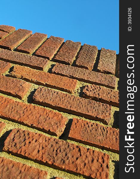 Red brick wall abstract with deep shadows