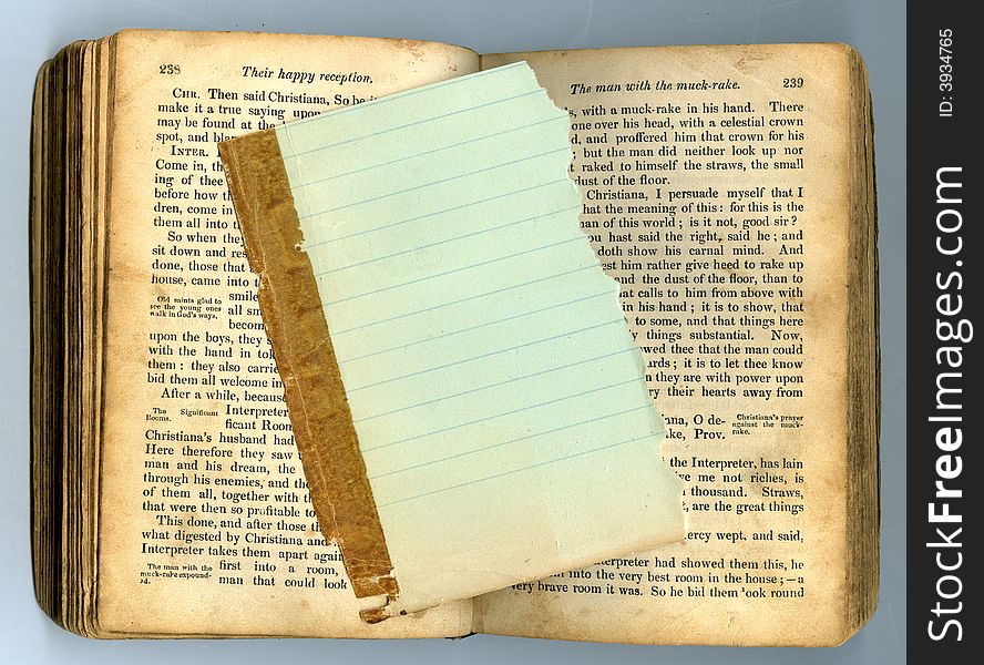 Lined paper on antique book opened