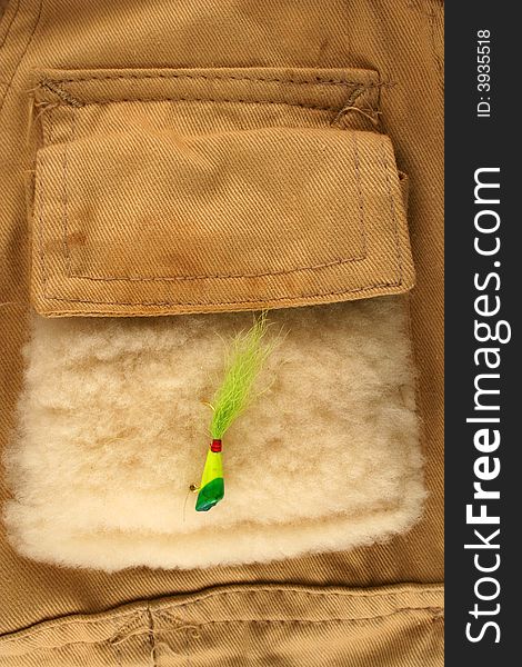 Fishing lure on a vest pocket