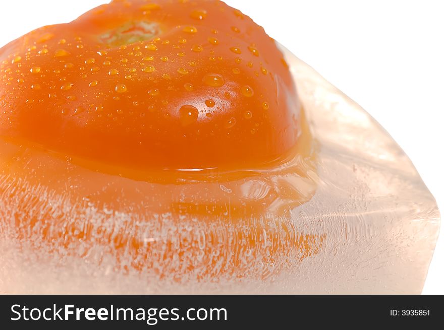 Close up on frozen tomato isolated on white background