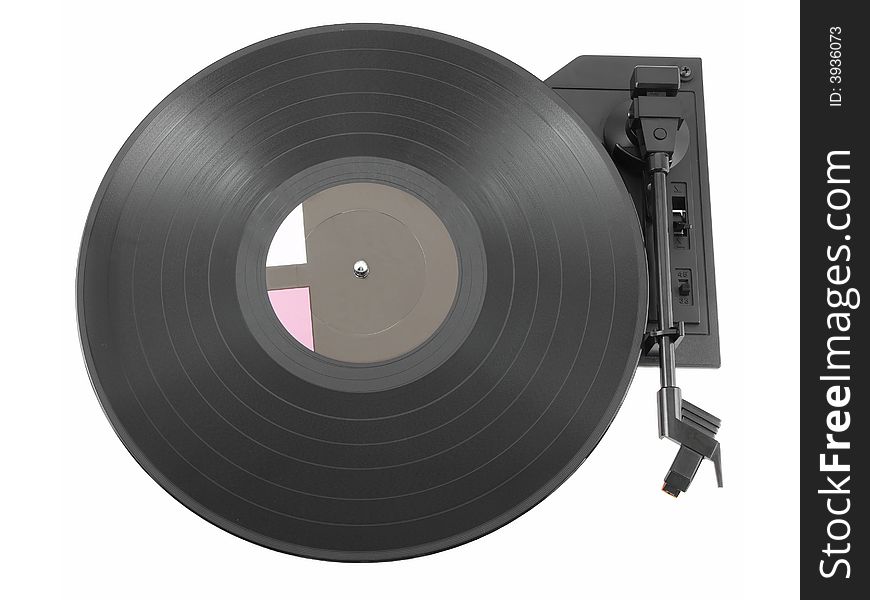 Vinyl record on a turntable isolated on white. Vinyl record on a turntable isolated on white