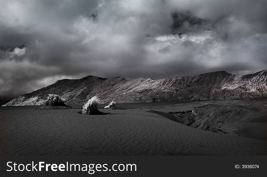 Bromo Mountain has always been fascinating object because of the mixture sand dune and mountainous area and mysterious cloud. The picture is taken using infra-red sensitive camera which adds more details to the clouds and its shadows. Bromo Mountain has always been fascinating object because of the mixture sand dune and mountainous area and mysterious cloud. The picture is taken using infra-red sensitive camera which adds more details to the clouds and its shadows.