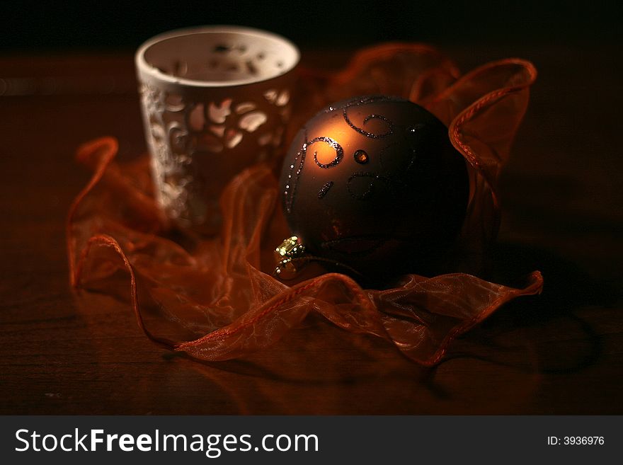 Holiday decoration made with a globe and a candle.