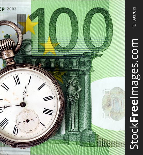 A view with a watch over a banknote. A view with a watch over a banknote