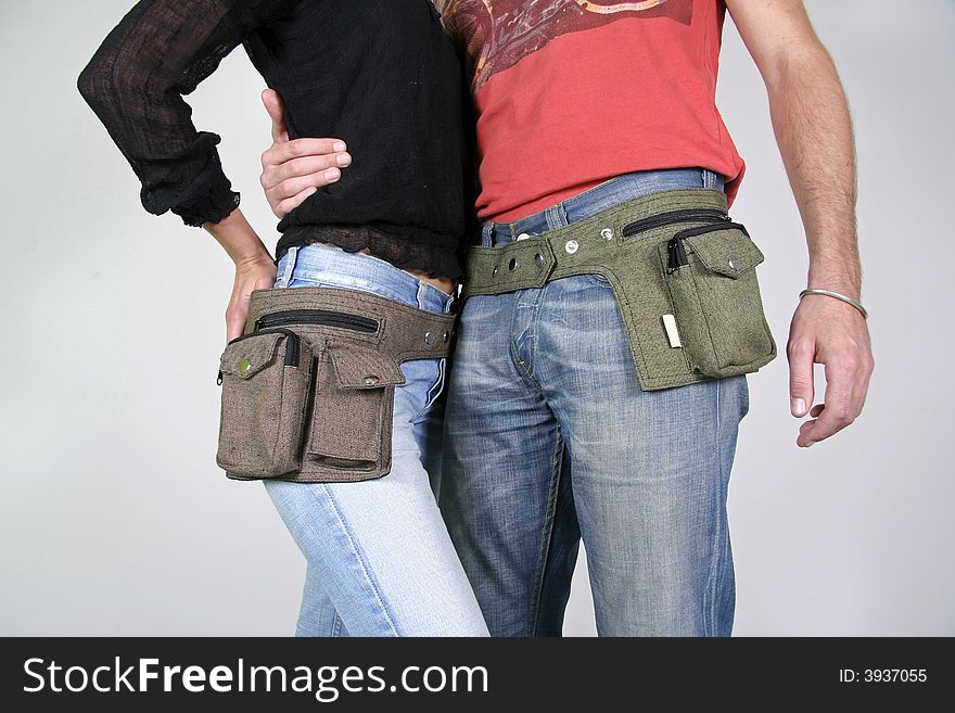 Couple posing with belt bag pouches. Couple posing with belt bag pouches