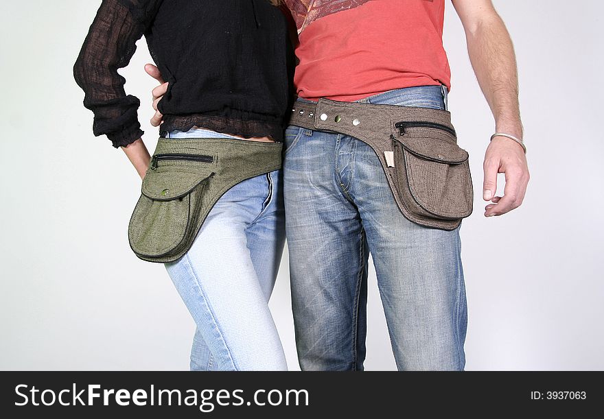 Couple posing with belt bag pouches. Couple posing with belt bag pouches