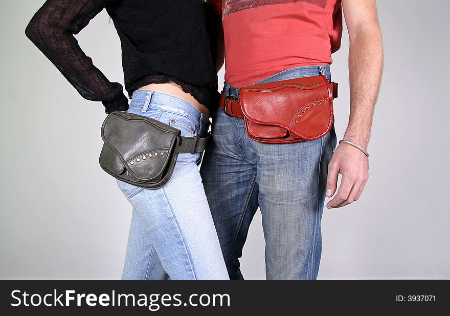 Couple posing with belt bag pouches. Couple posing with belt bag pouches