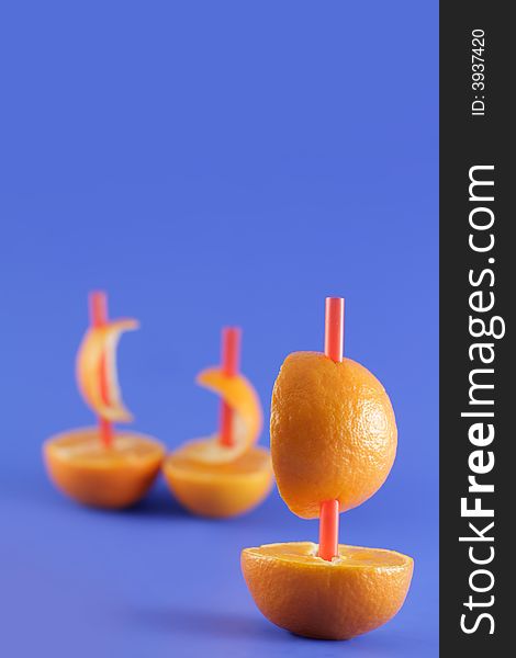 Image from creative series: boats of mandarins on blue background