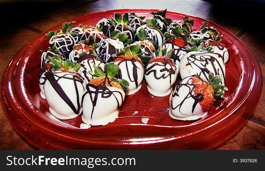 A dish of delicious chocolate covered strawberries. A dish of delicious chocolate covered strawberries