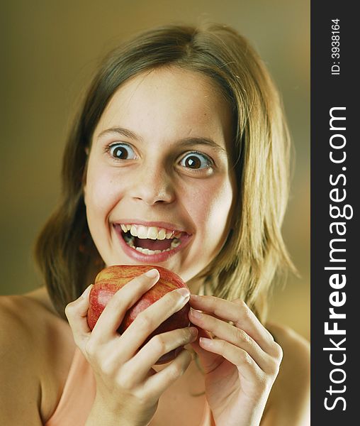 A smiling girl with an apple. A smiling girl with an apple