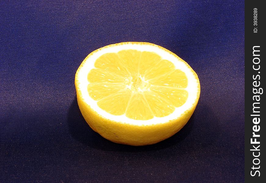 Half lemon on a blue background