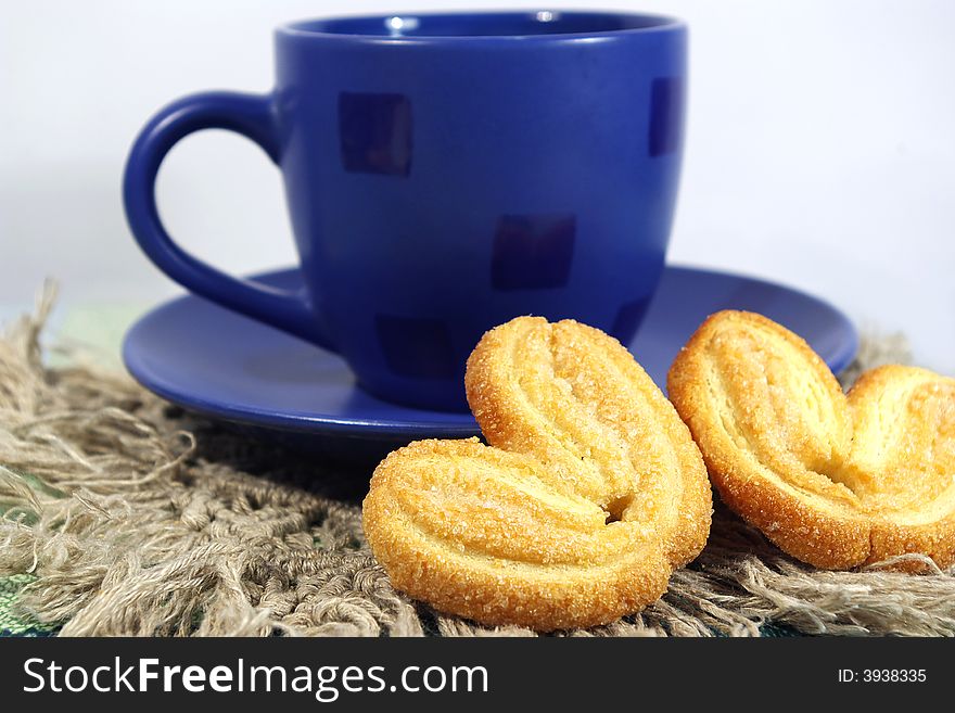 Blue cup of tea and two cookies. Blue cup of tea and two cookies
