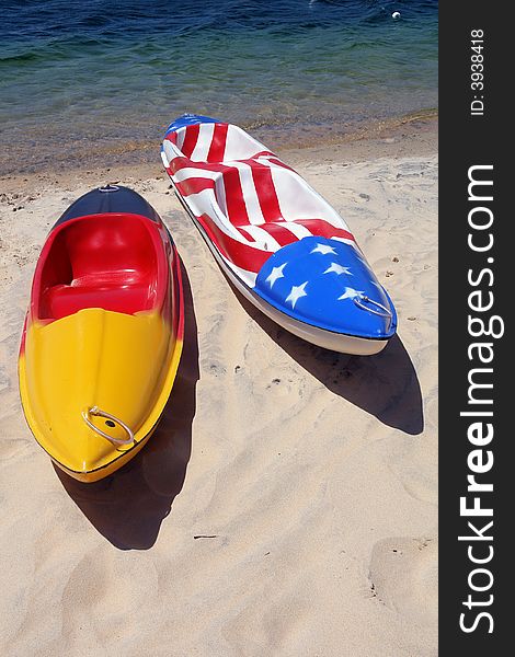 Kayaks at beach with flag colors. Kayaks at beach with flag colors