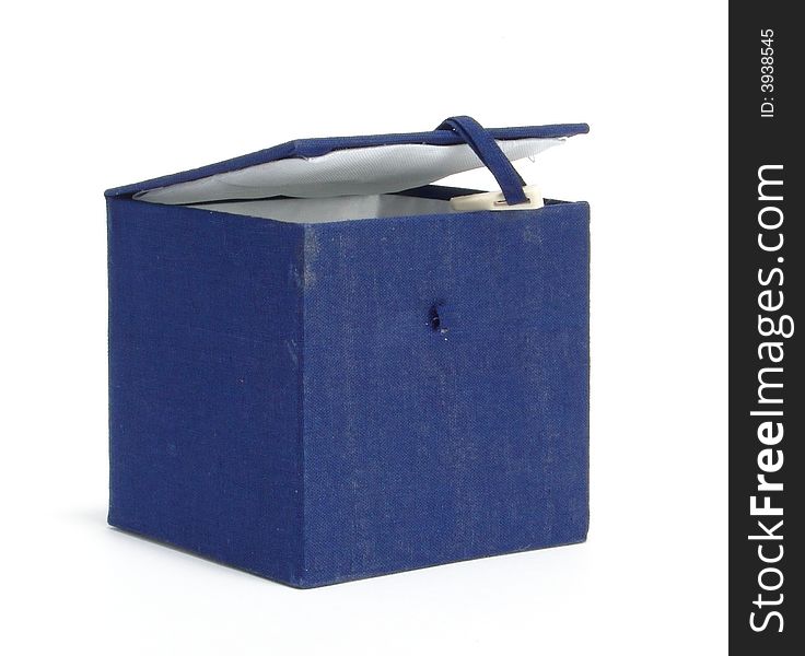 A box on a homogeneous background. Ornamented blue cloth. Inside the white cloth. A box on a homogeneous background. Ornamented blue cloth. Inside the white cloth.