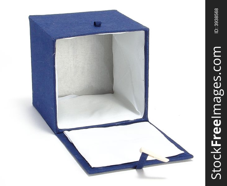 A box on a homogeneous background. Ornamented blue cloth. Inside the white cloth. A box on a homogeneous background. Ornamented blue cloth. Inside the white cloth.