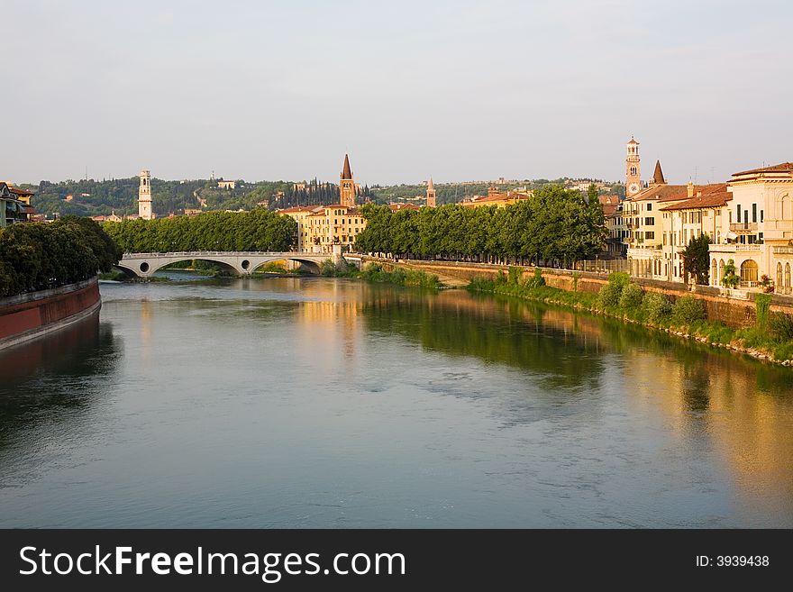 Verona, northern Italy. View of city and river in evening sunlight. Verona, northern Italy. View of city and river in evening sunlight.