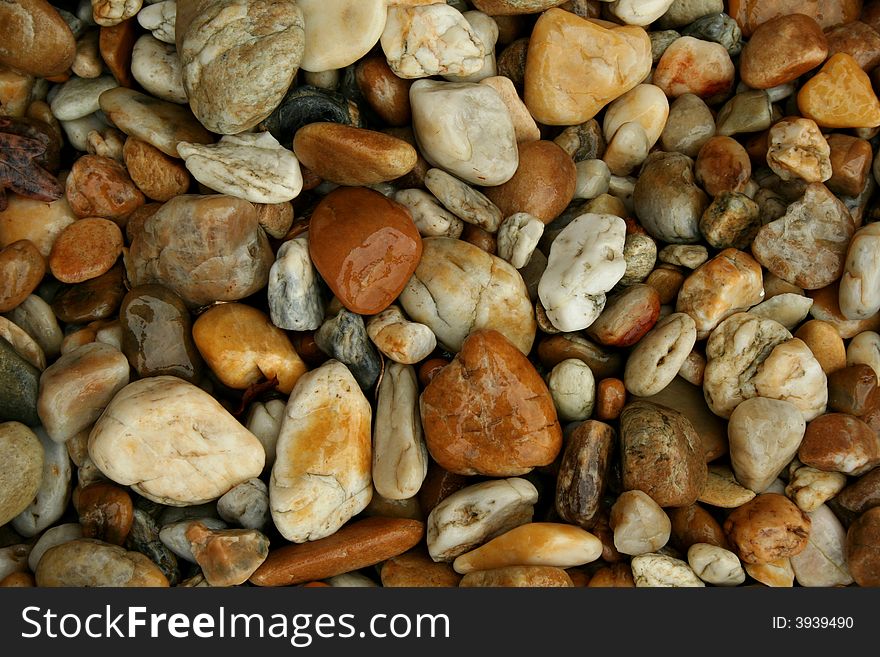 Wet colorful pebbles (gravel, pebble stones)