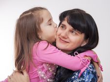 Girl Kissing Her Mother Royalty Free Stock Image