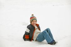 Boy Playing In The Snow Stock Photo
