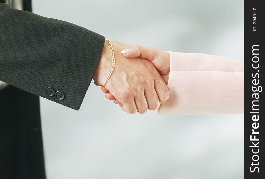 Shaking hands over white background