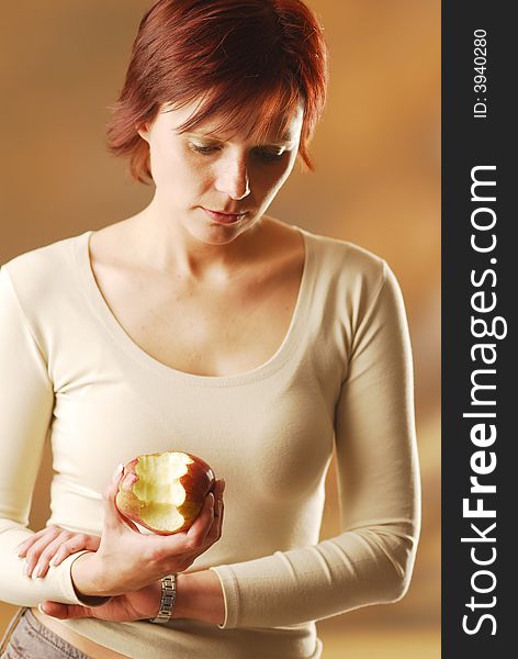 A portrait of woman with an apple. A portrait of woman with an apple