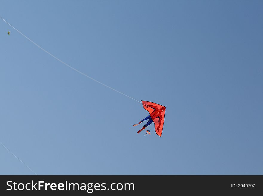 Superman kite flying in the blue sky