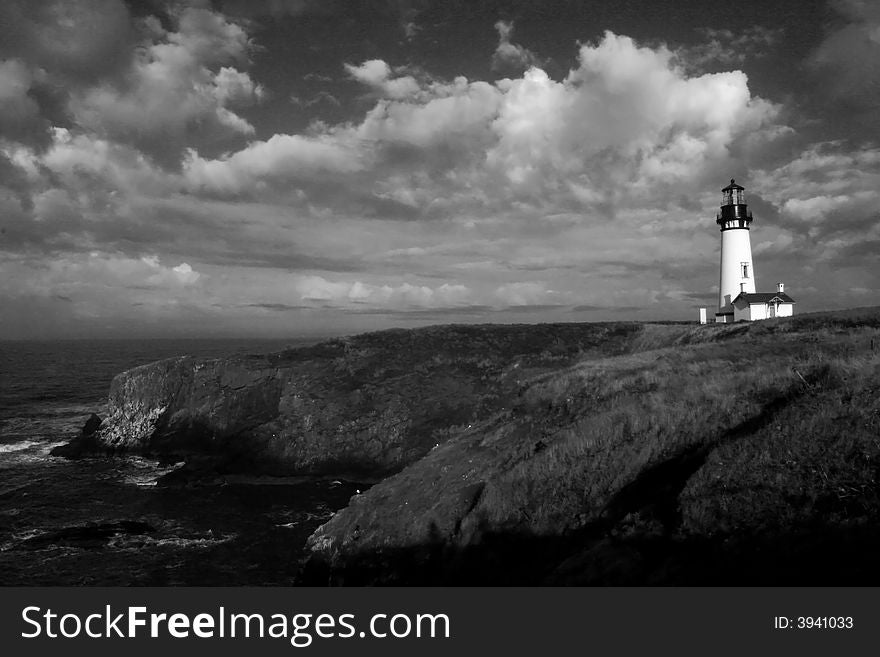 Yaquina head lighthouse on the oregon coast helps to safely guide north and south bound shipping on the pacific ocean. Yaquina head lighthouse on the oregon coast helps to safely guide north and south bound shipping on the pacific ocean