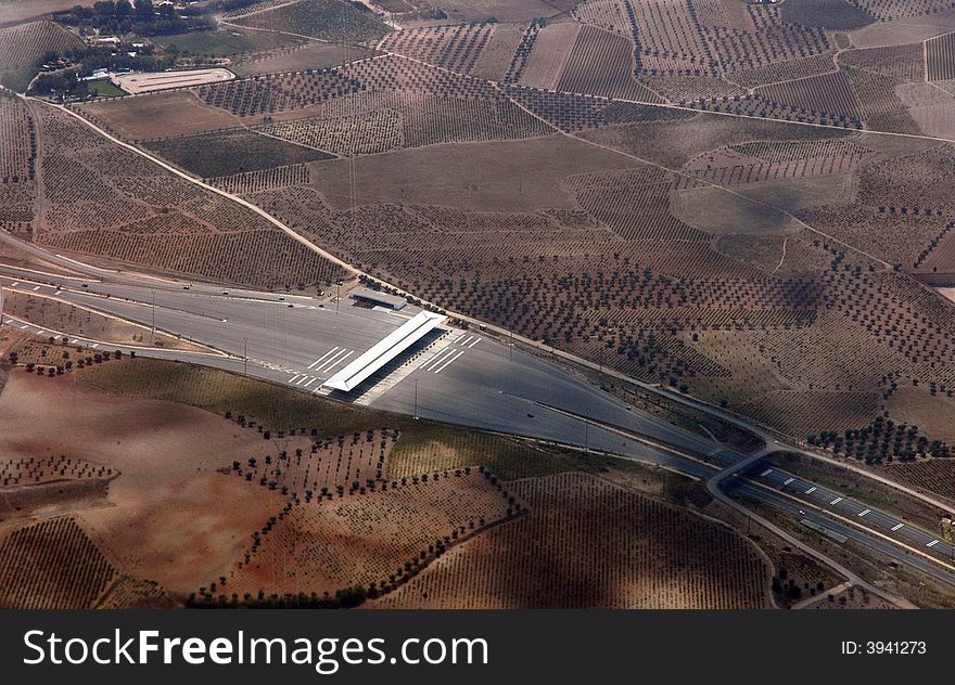 A landscape with a motorway from the plane. A landscape with a motorway from the plane