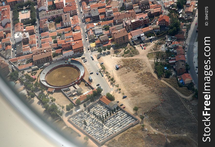 A landscape with a town with a stadium from the plane. A landscape with a town with a stadium from the plane