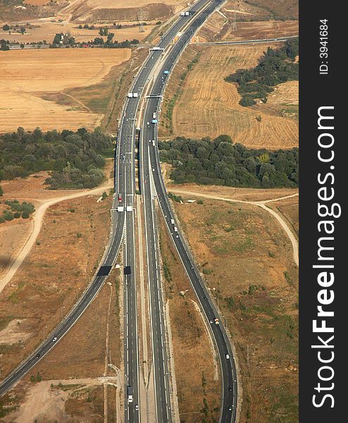 A landscape with a motorway from the plane. A landscape with a motorway from the plane