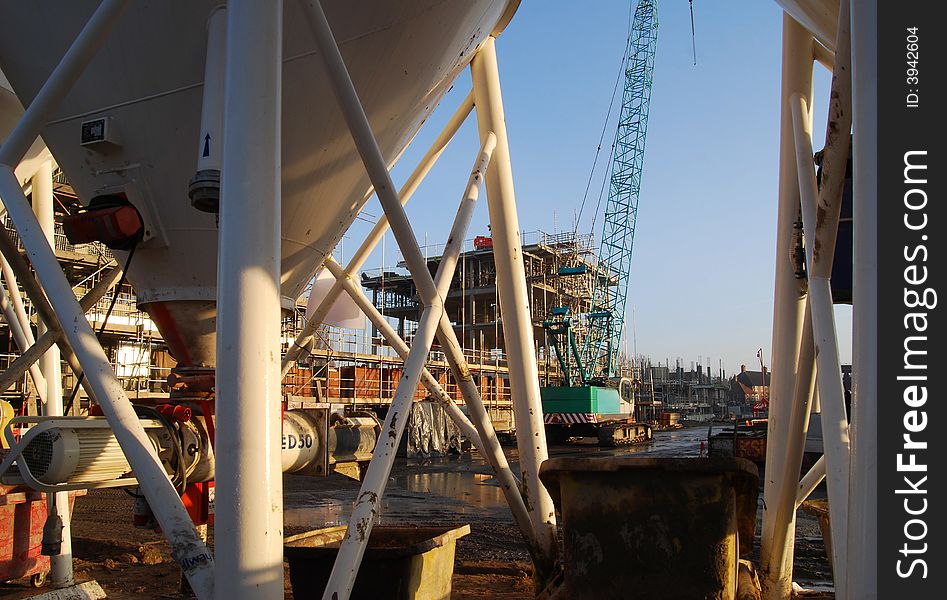 View of building site showing crane and building. View of building site showing crane and building