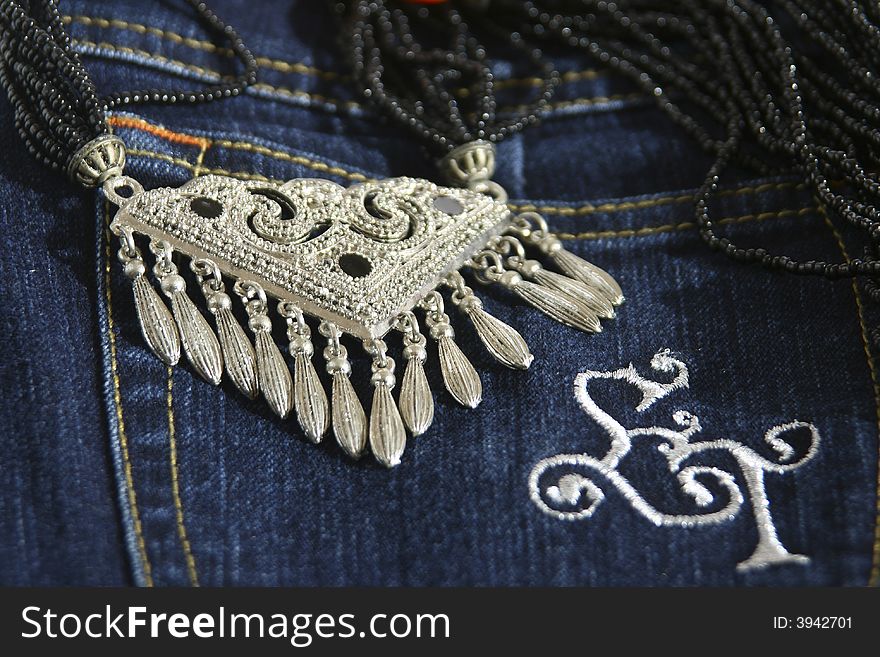 Chinese traditional necklace and jeans