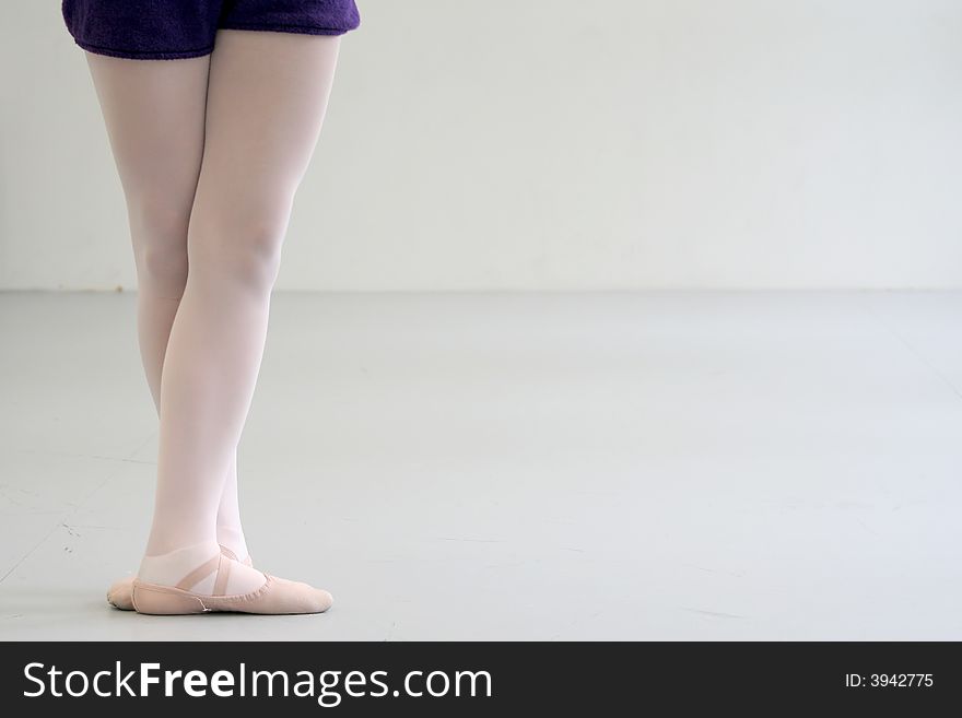 Ballerina with crossed feets standing I