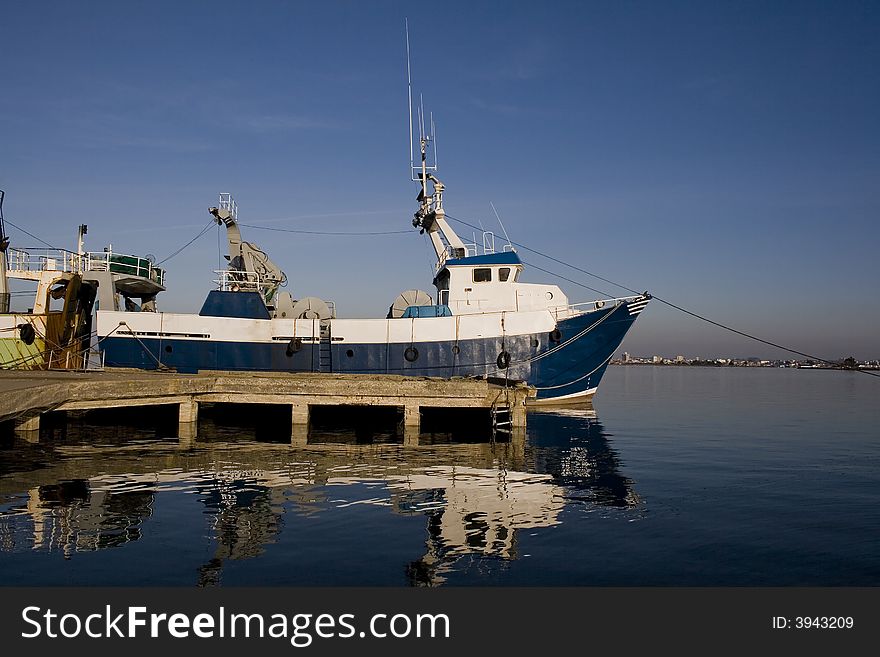 Fishing ship into the harbor. Fishing ship into the harbor