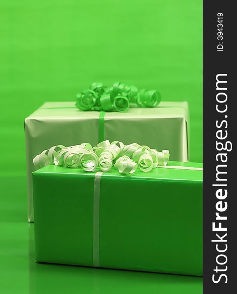 Presents wrapped in light and dark green paper. Presents wrapped in light and dark green paper