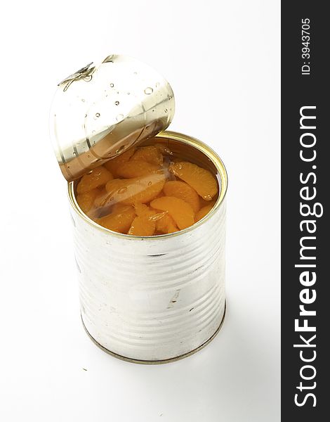 Tin with tangerines on white background