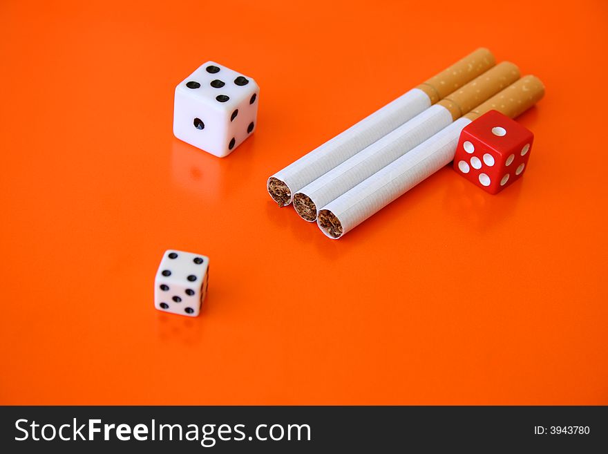 Cigarettes and dice, a gamble with your life. Cigarettes and dice, a gamble with your life