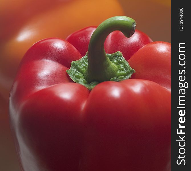 Studio close up of red pepper and stem