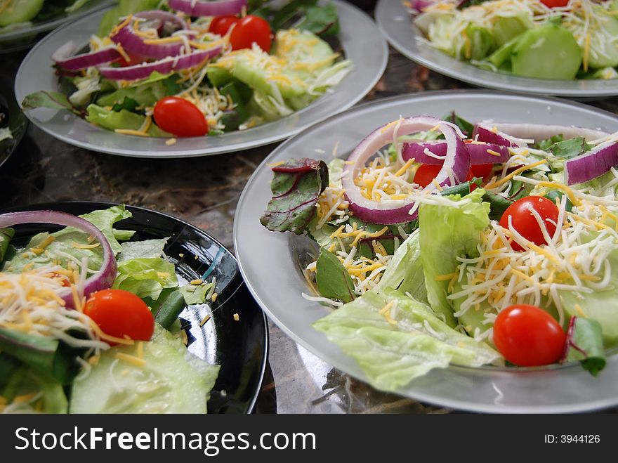 Toss salads on crystal plates. Toss salads on crystal plates.