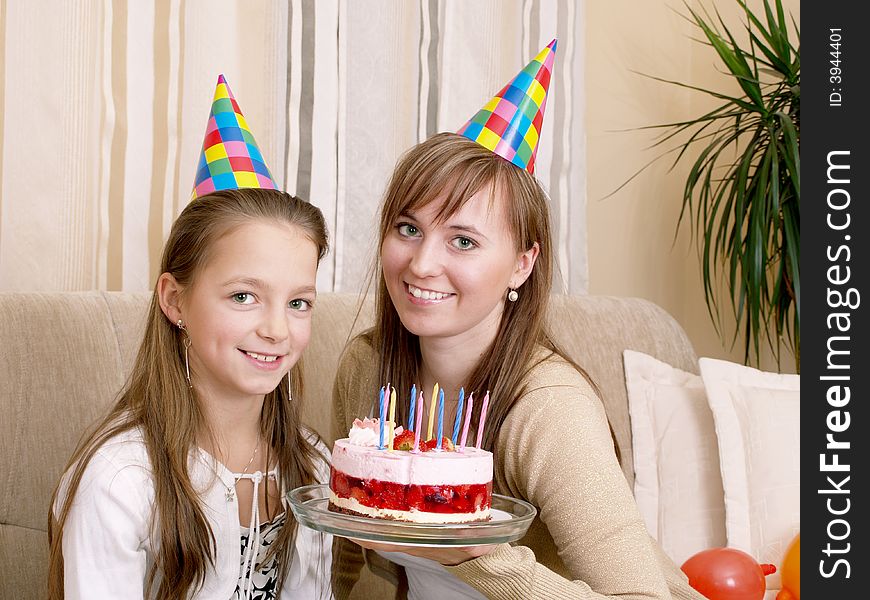 Mother with daughter and birthday cake. Mother with daughter and birthday cake