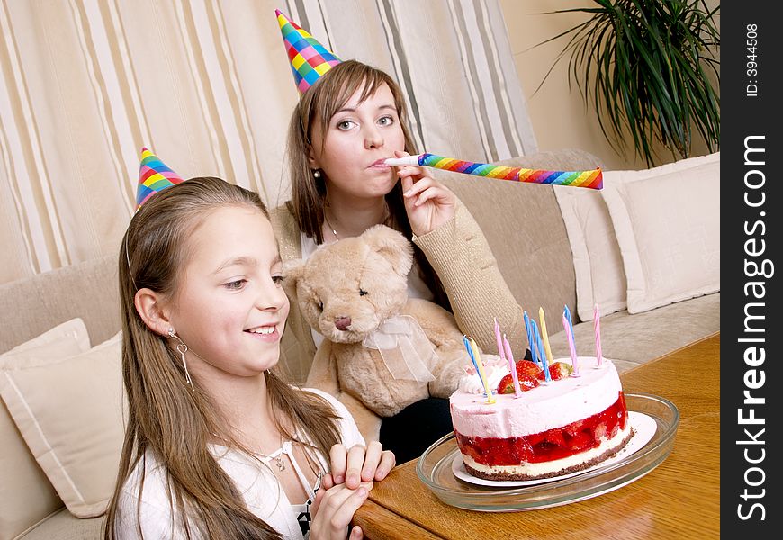 Mother with daughter and birthday cake. Mother with daughter and birthday cake