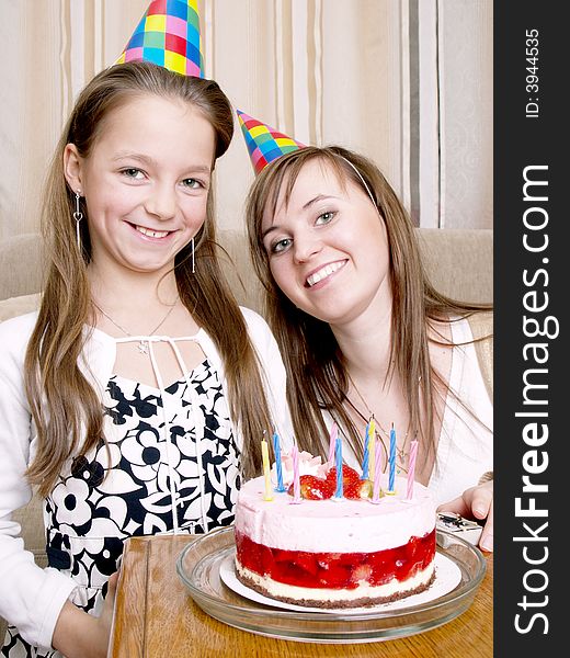 Mother with daughter and birthday cake. Mother with daughter and birthday cake