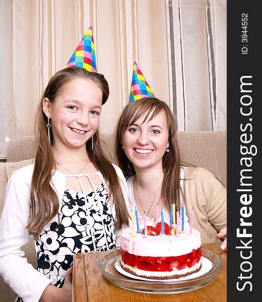 Mother with daughter and birthday cake. Mother with daughter and birthday cake