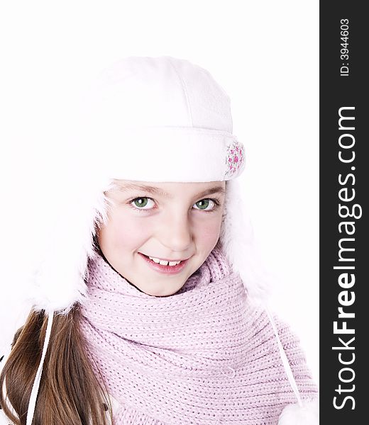 Closeup of girl, wearing wool winter hat and scarf