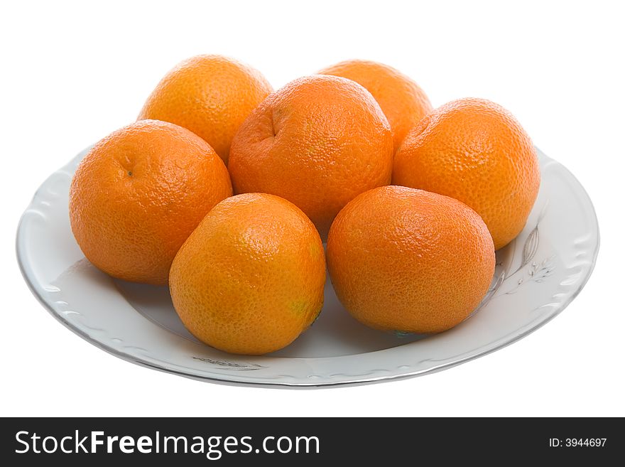 Tangerines on white plate isolated