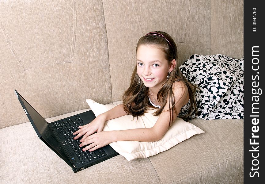 Young girl using a laptop. Computer generation