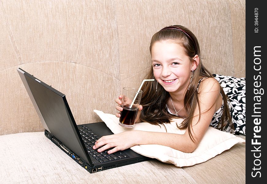 Young Girl Using A Laptop.