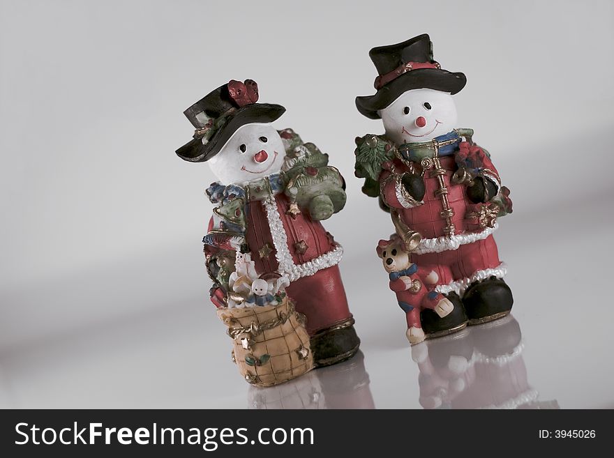 Two figures of small snowmen. Two figures of small snowmen