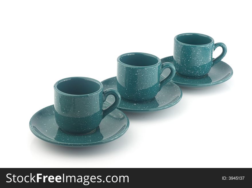 Three green cups isolated on white background with saucer. Three green cups isolated on white background with saucer