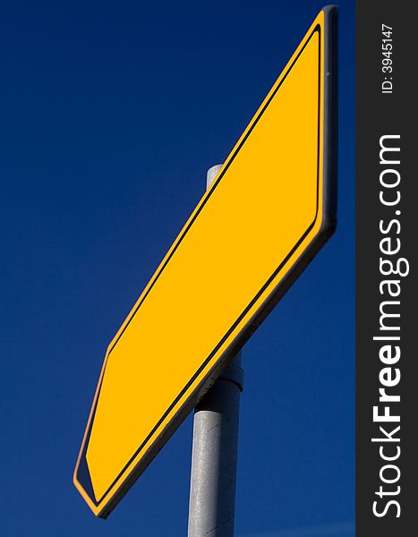 Traffic sign of direction over blue sky